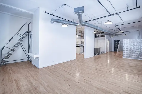 a view of entryway with wooden floor