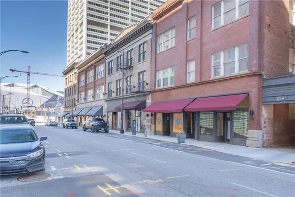 a street view with building and retail shops