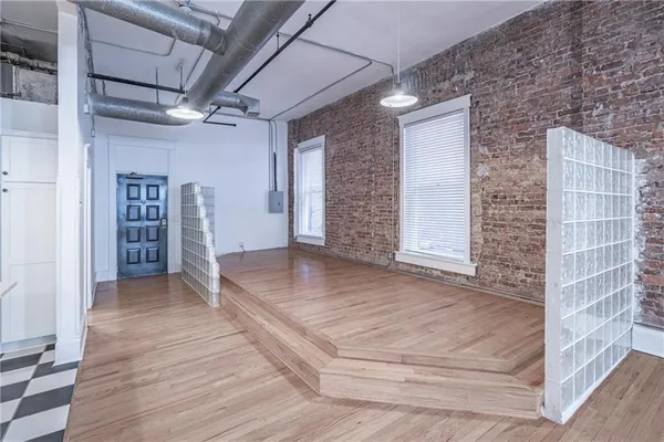 a view of an empty room with a bathroom