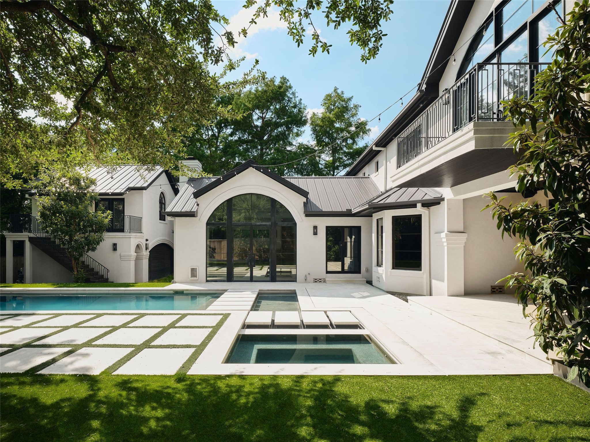 a swimming pool with outdoor seating and yard
