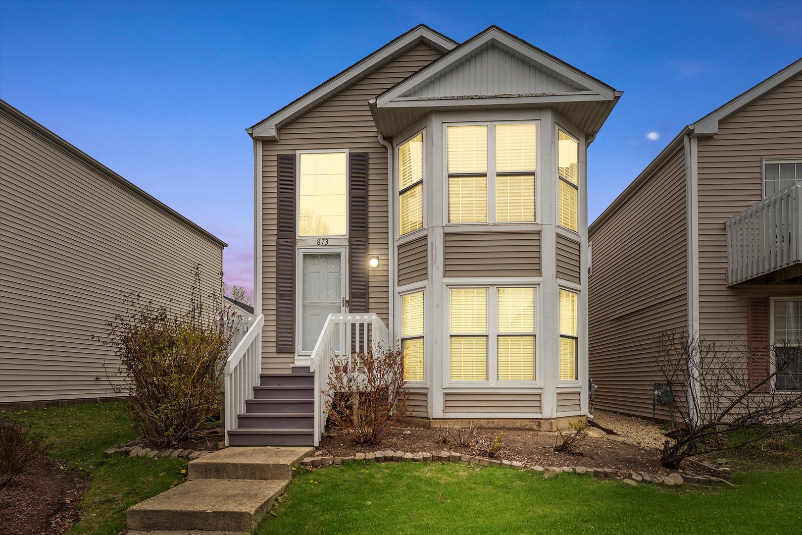 873 Symphony Drive Aurora, IL 60504 - Photo 1 of 24 a front view of a house with a yard