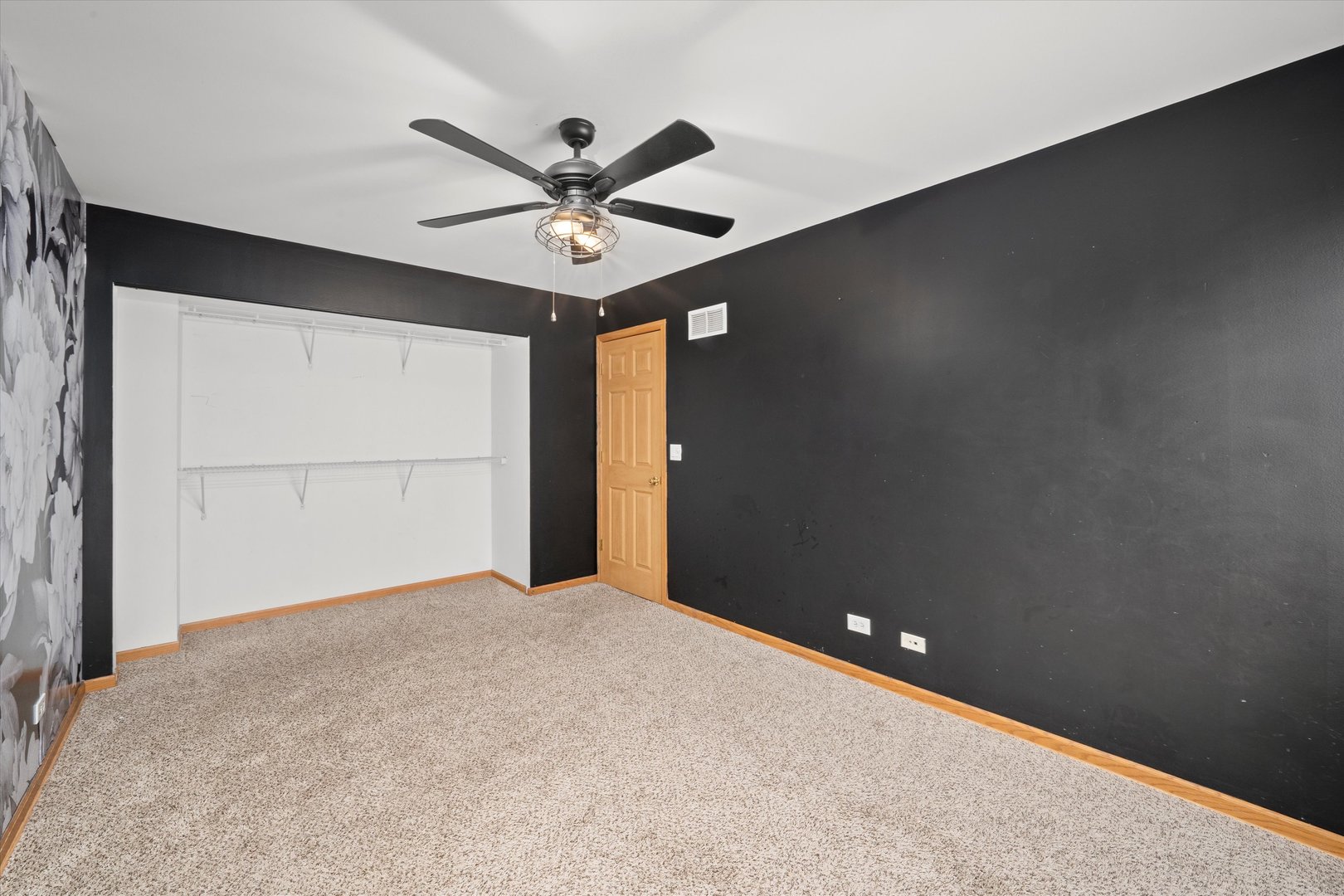 873 Symphony Drive Aurora, IL 60504 - Photo 11 of 24 a view of a big room with a ceiling fan and a window