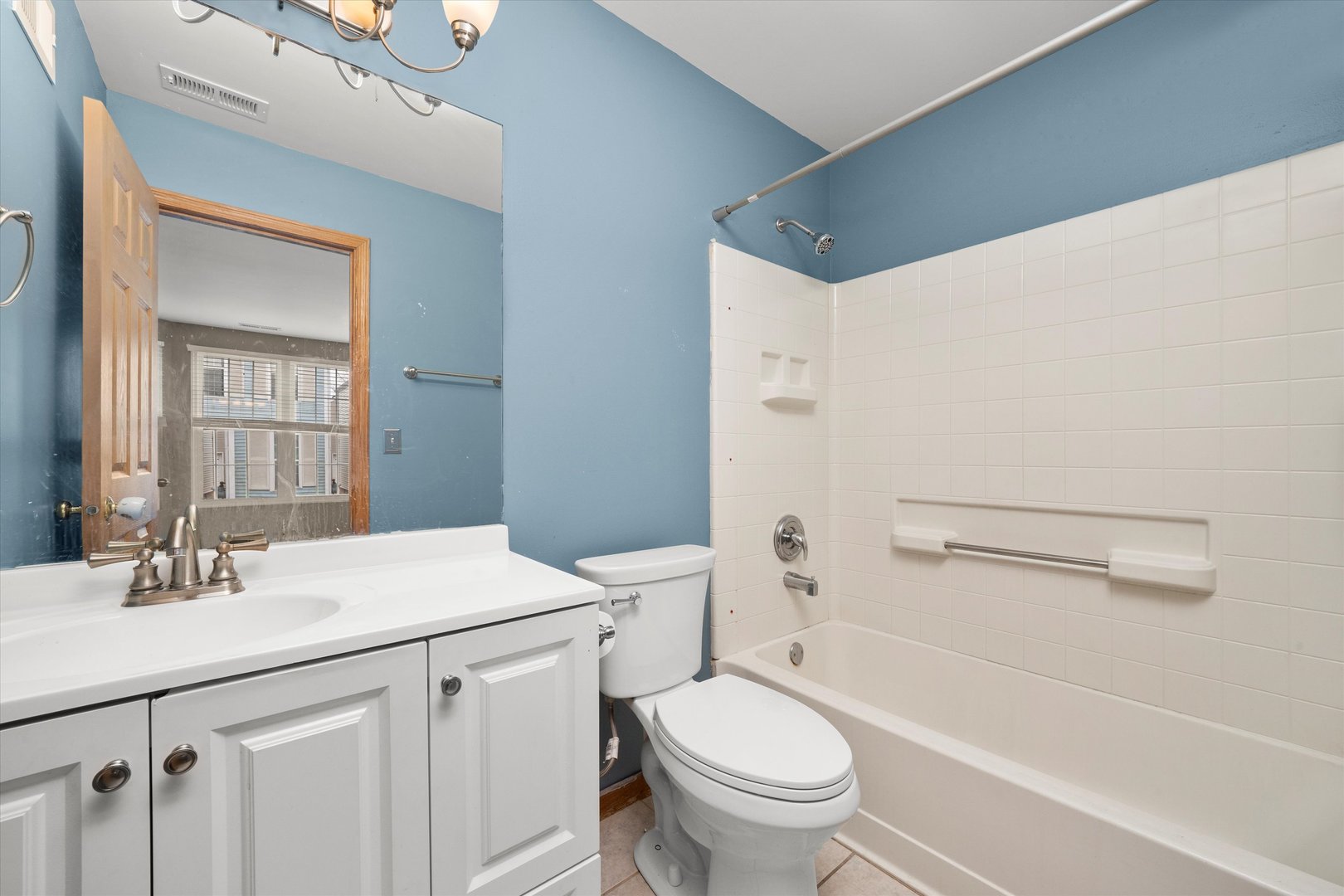 873 Symphony Drive Aurora, IL 60504 - Photo 19 of 24 a bathroom with a sink toilet and vanity