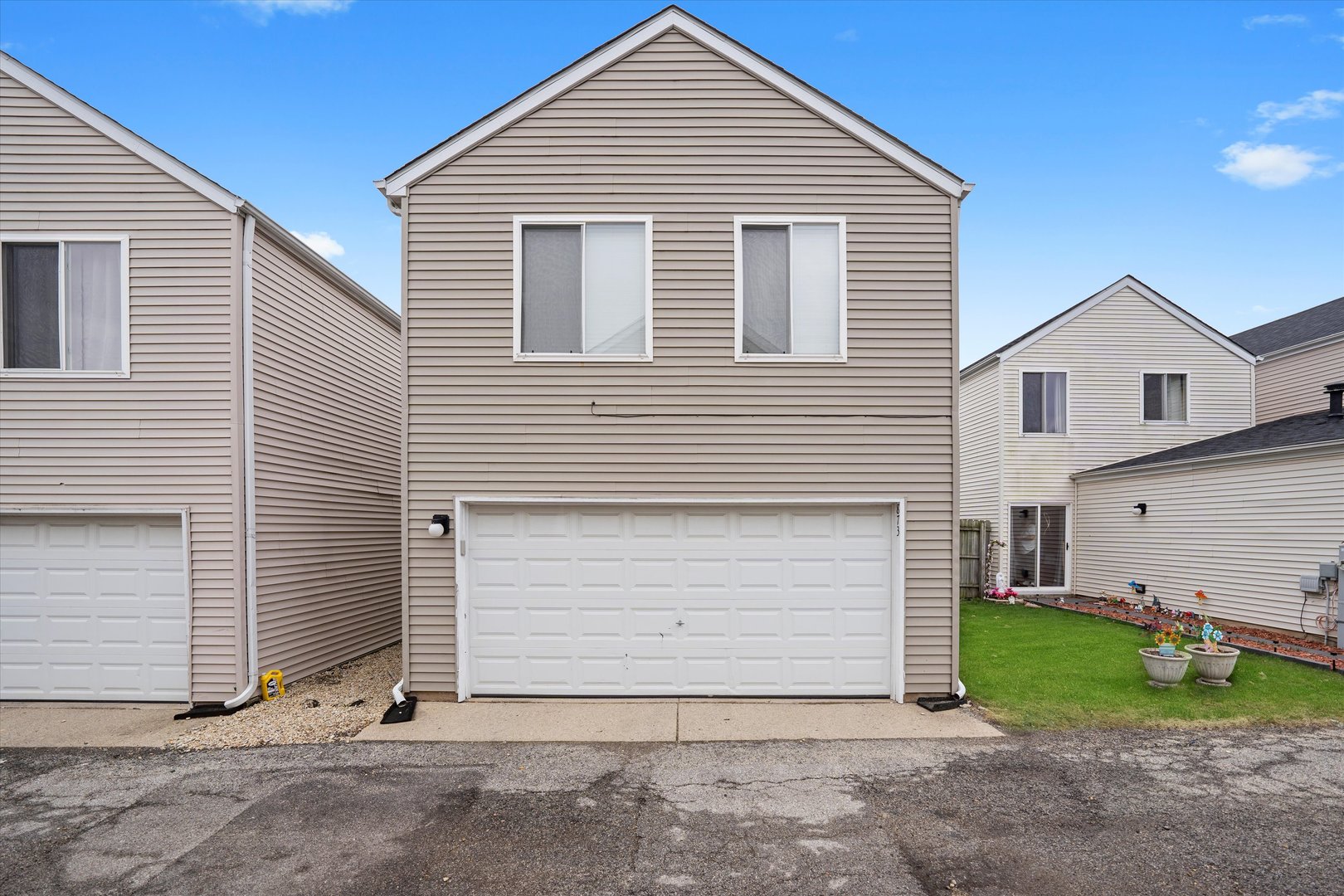 873 Symphony Drive Aurora, IL 60504 - Photo 22 of 24 a view of backyard of house and garage