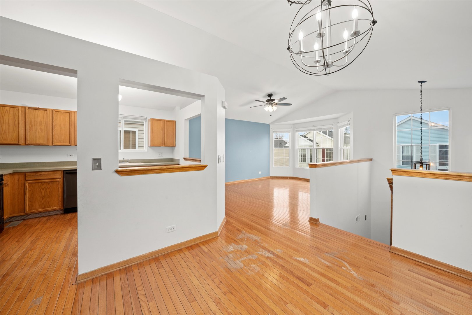873 Symphony Drive Aurora, IL 60504 - Photo 3 of 24 a kitchen view with wooden floor and a view of kitchen
