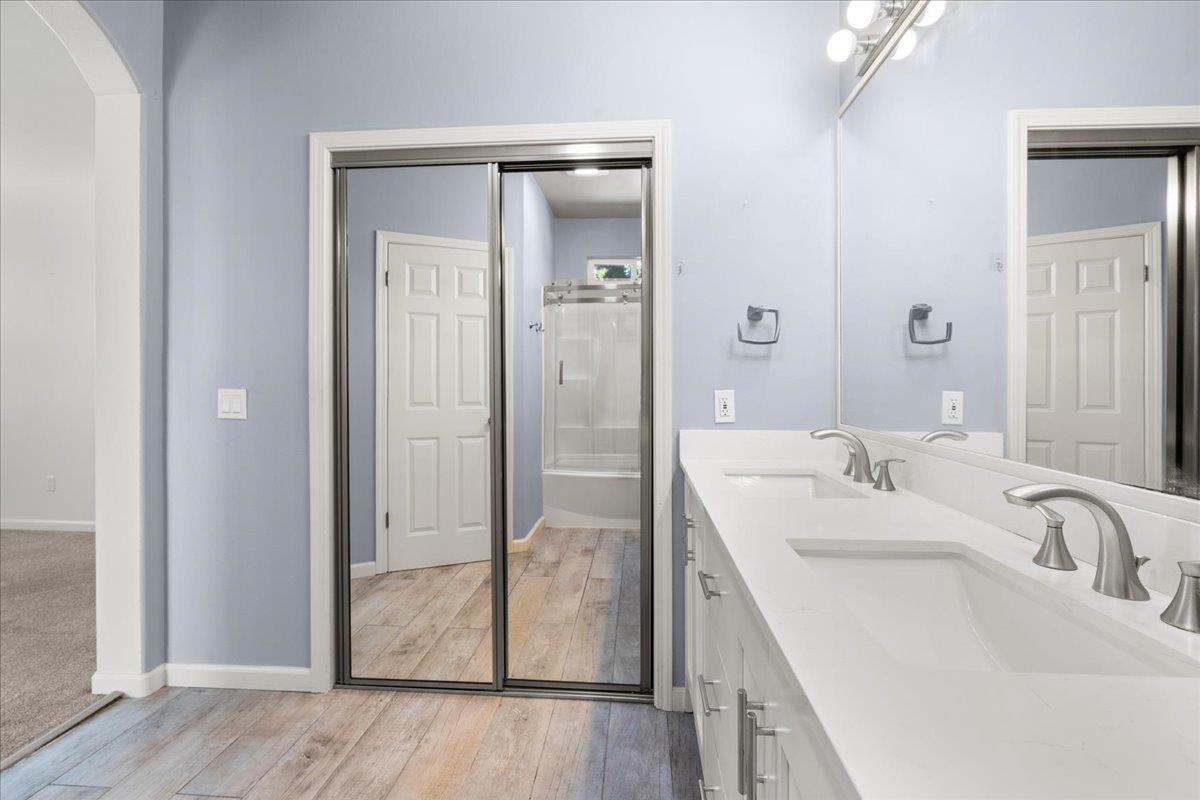 478 Churchill Way Salinas, CA 93906 - Photo 17 of 31 a bathroom with a double vanity sink and mirror
