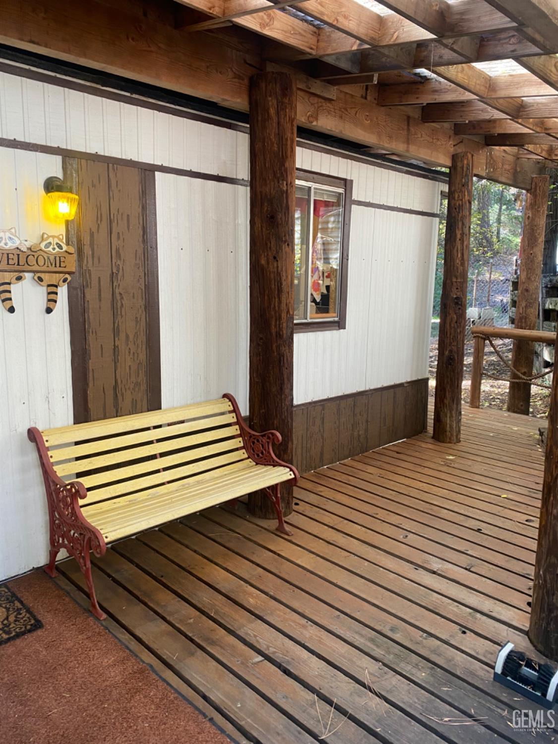 a view of a wooden floor with a table and chairs