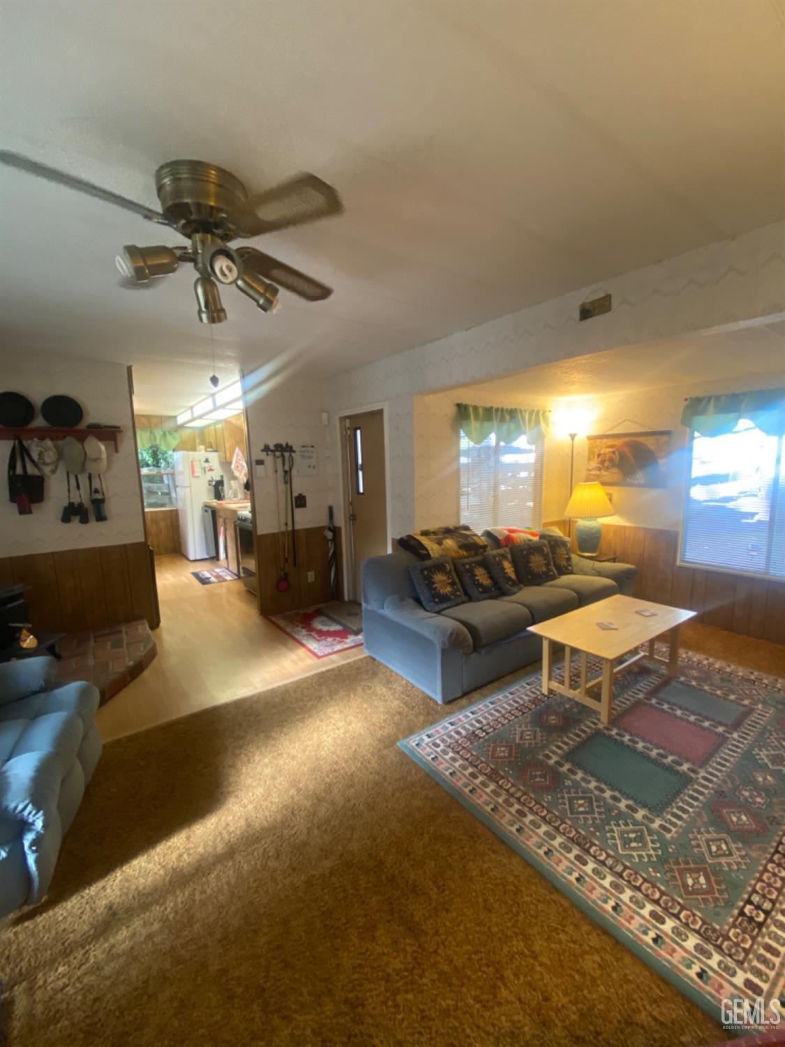 Undisclosed Address Posey, CA 93260 - Photo 2 of 19 a living room with furniture and a chandelier