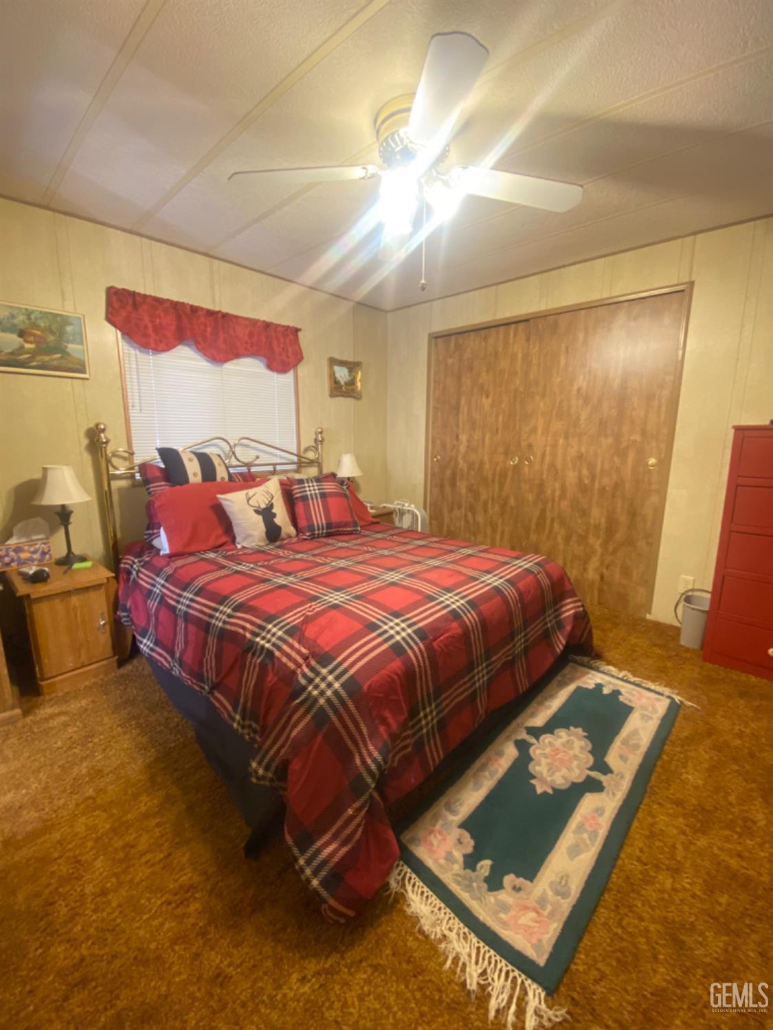 Undisclosed Address Posey, CA 93260 - Photo 5 of 19 a bedroom with a bed and wooden floor