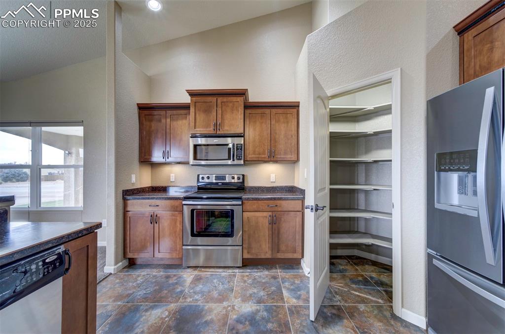 24484 Gale Road Pueblo, CO 81006 - Photo 18 of 43 a kitchen with a stove oven and a sink