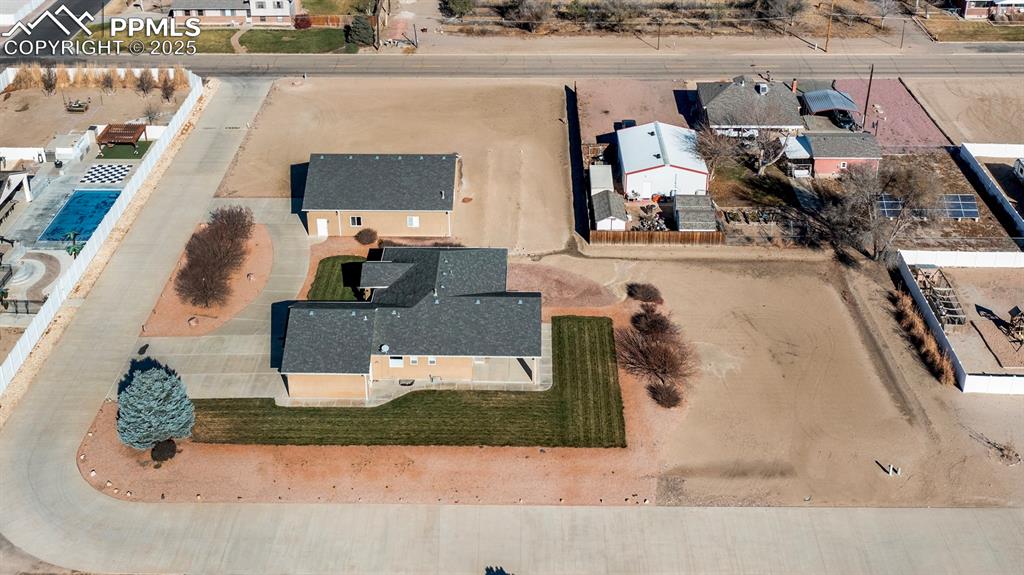 24484 Gale Road Pueblo, CO 81006 - Photo 37 of 43 an aerial view of a house with a swimming pool