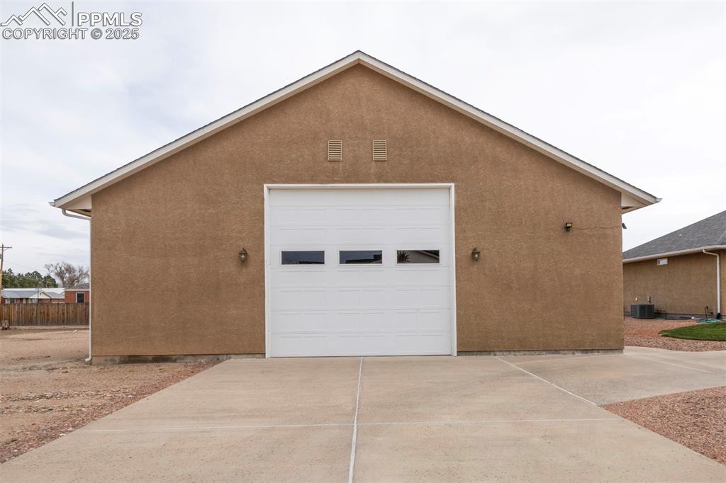 24484 Gale Road Pueblo, CO 81006 - Photo 4 of 43 a front view of a house with garage