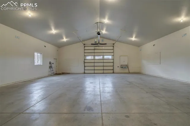 a view of a livingroom with furniture and a window