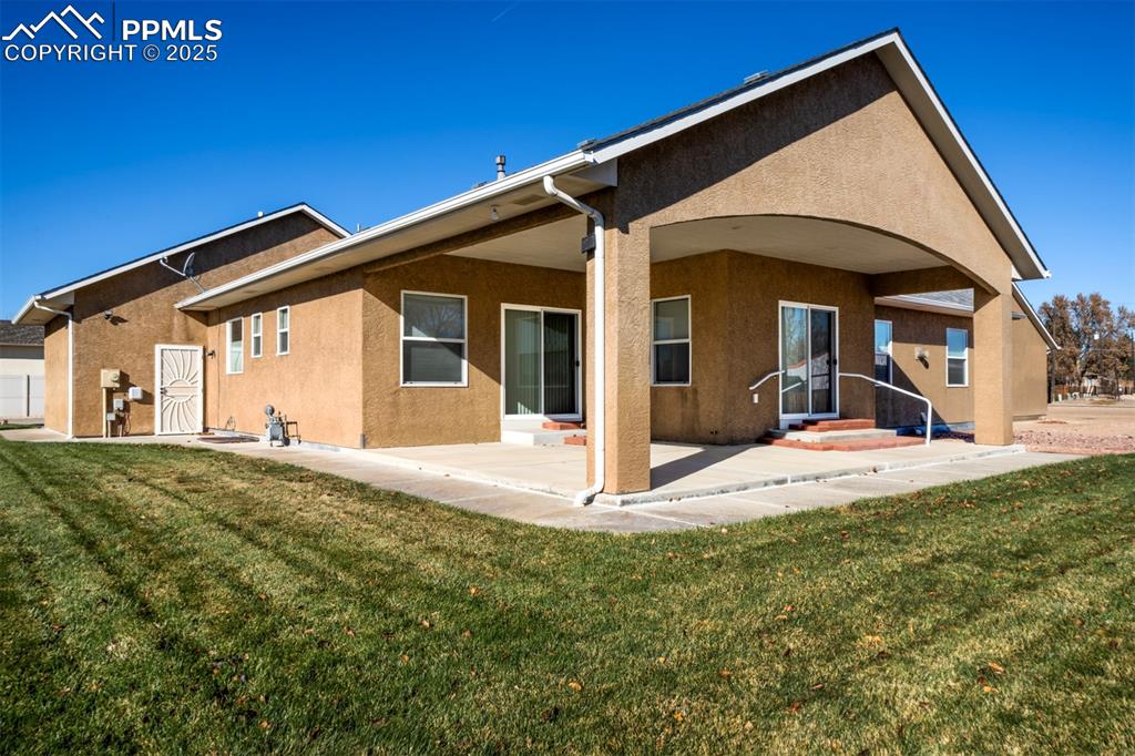 24484 Gale Road Pueblo, CO 81006 - Photo 10 of 43 a view of a house with a big yard and large tree