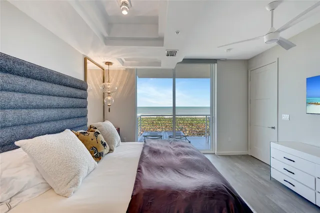 a bed room with a bed and a window