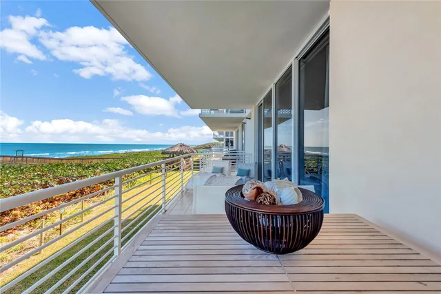 a view of balcony with furniture