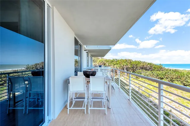 a view of a balcony with chairs
