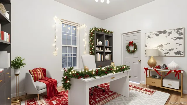 a living room with furniture flowerpot and wooden floor