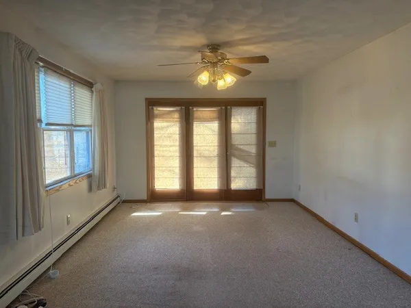 a view of an empty room with a window