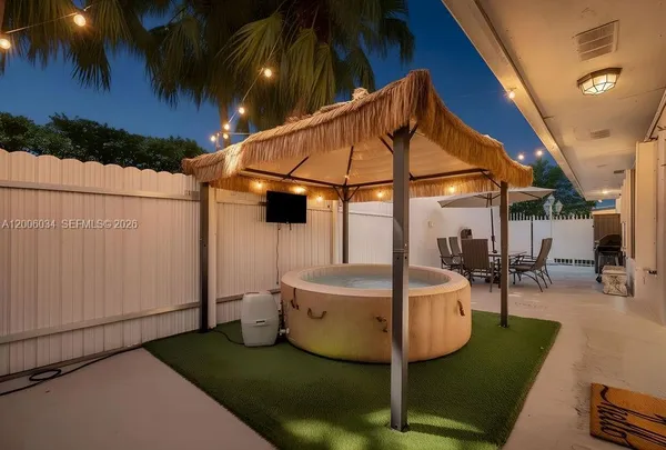 a view of a swimming pool with a patio