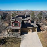 a aerial view of a house with a mountain