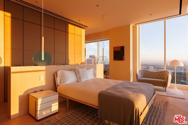 a bedroom with a bed and a night stand