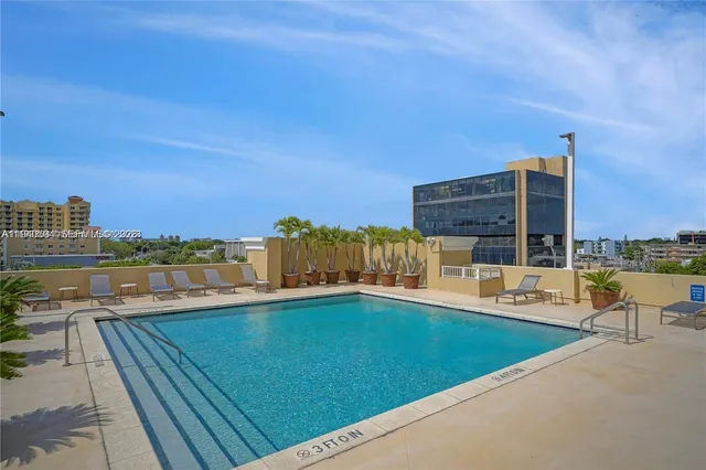 a view of a swimming pool with a lounge chair