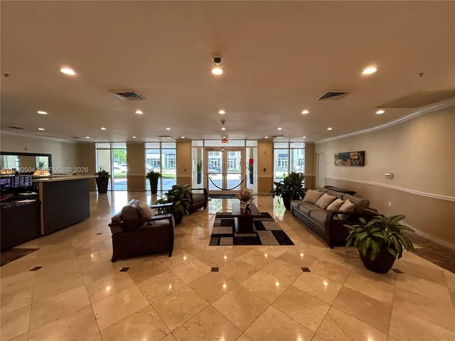 a large room with lots of furniture and a large window