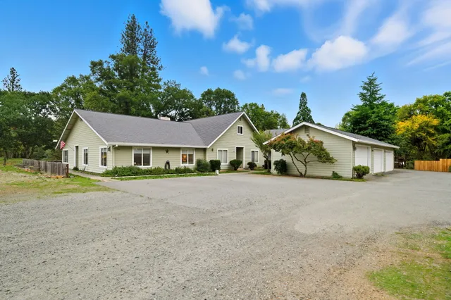 a view of house with outdoor space and street view
