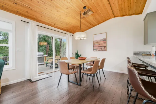 a dining room with furniture window wooden floor