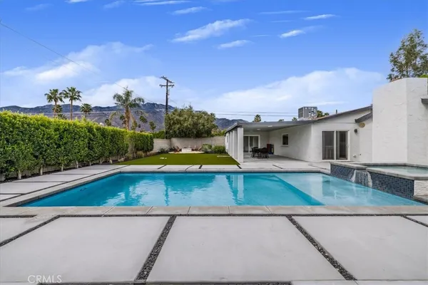swimming pool view with sitting space