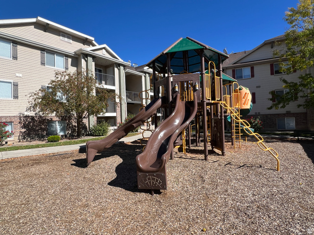 8198 North Cedar Springs Road, Unit T6 Eagle Mountain, UT 84005 - Photo 12 of 13 Community playground featuring multiple slides and climbing elements