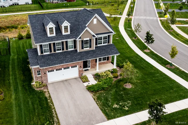 an aerial view of a house with a garden