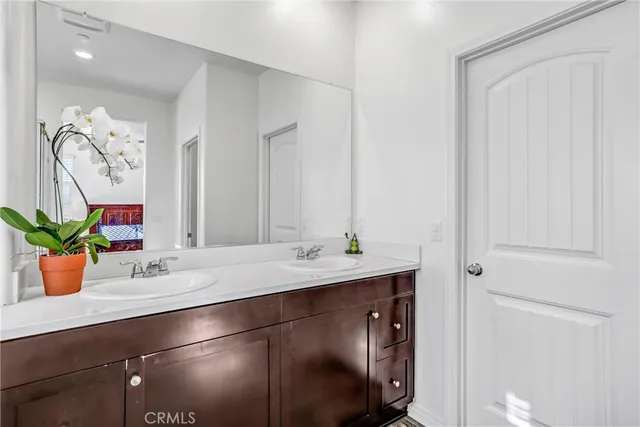 a room with a sink and a mirror