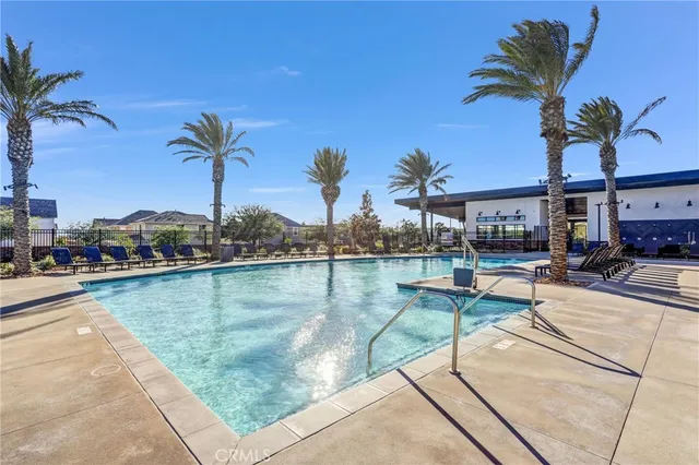 a view of a swimming pool and lounge chair