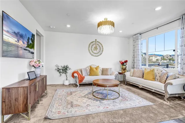 a living room with furniture and a clock