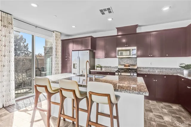 a kitchen with granite countertop lots of counter top space