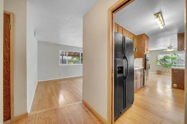 a view of a hallway view with wooden floor and staircase