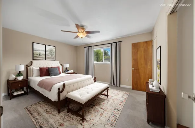 a bedroom with bed and window