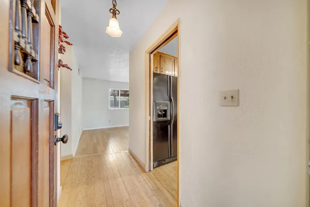 a view of livingroom with hardwood floor and hallway