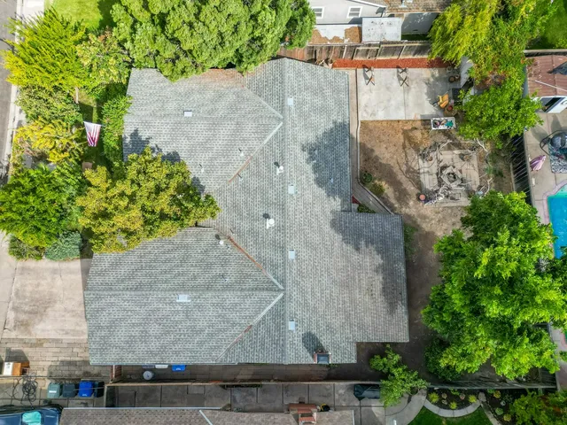 an aerial view of a residential houses with outdoor space