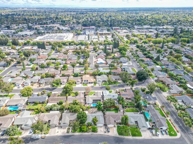 an aerial view of residential houses with outdoor space