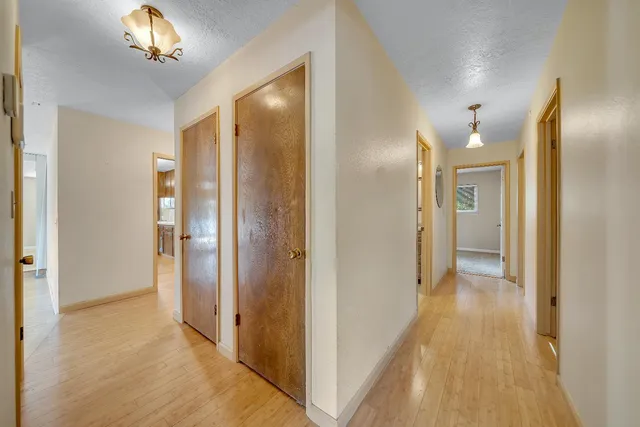 a view of hallway with wooden floor