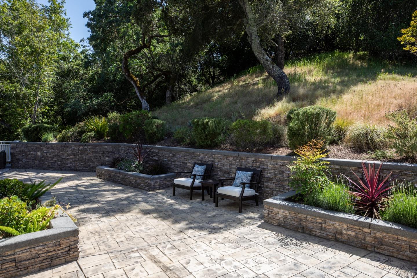 345 Harcross Road Woodside, CA 94062 - Photo 27 of 37 a backyard of a house with lots of green space and plants