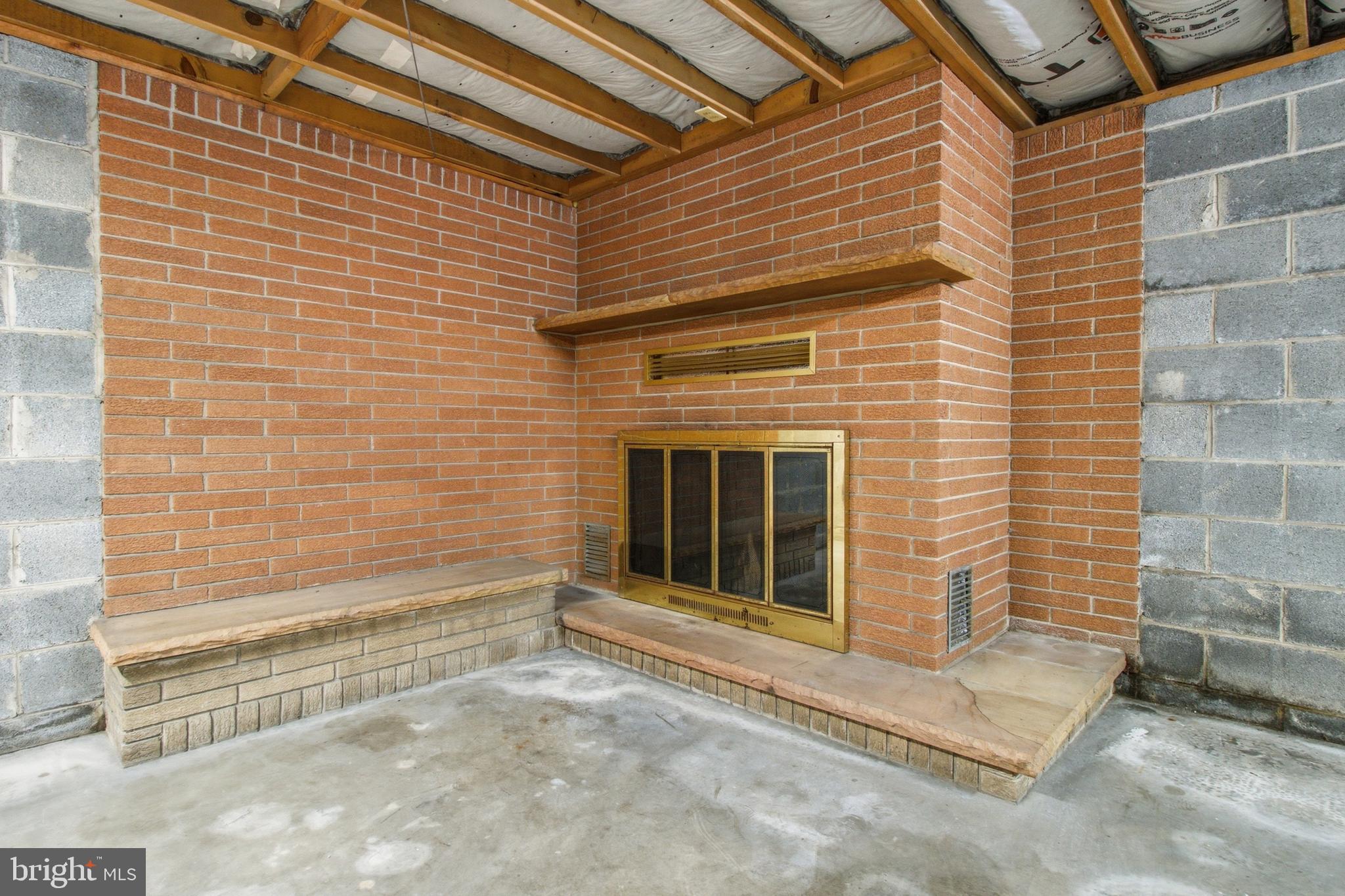 3361 Tyrone Pike Sandy Ridge, PA 16677 - Photo 29 of 53 Basement (wood fireplace in unfinished basement)