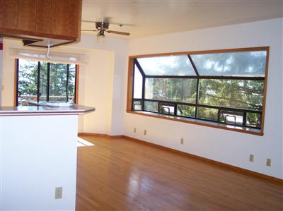 5261 Blue Lake Road Willits, CA 95490 - Photo 5 of 5 an empty room with wooden floor and windows