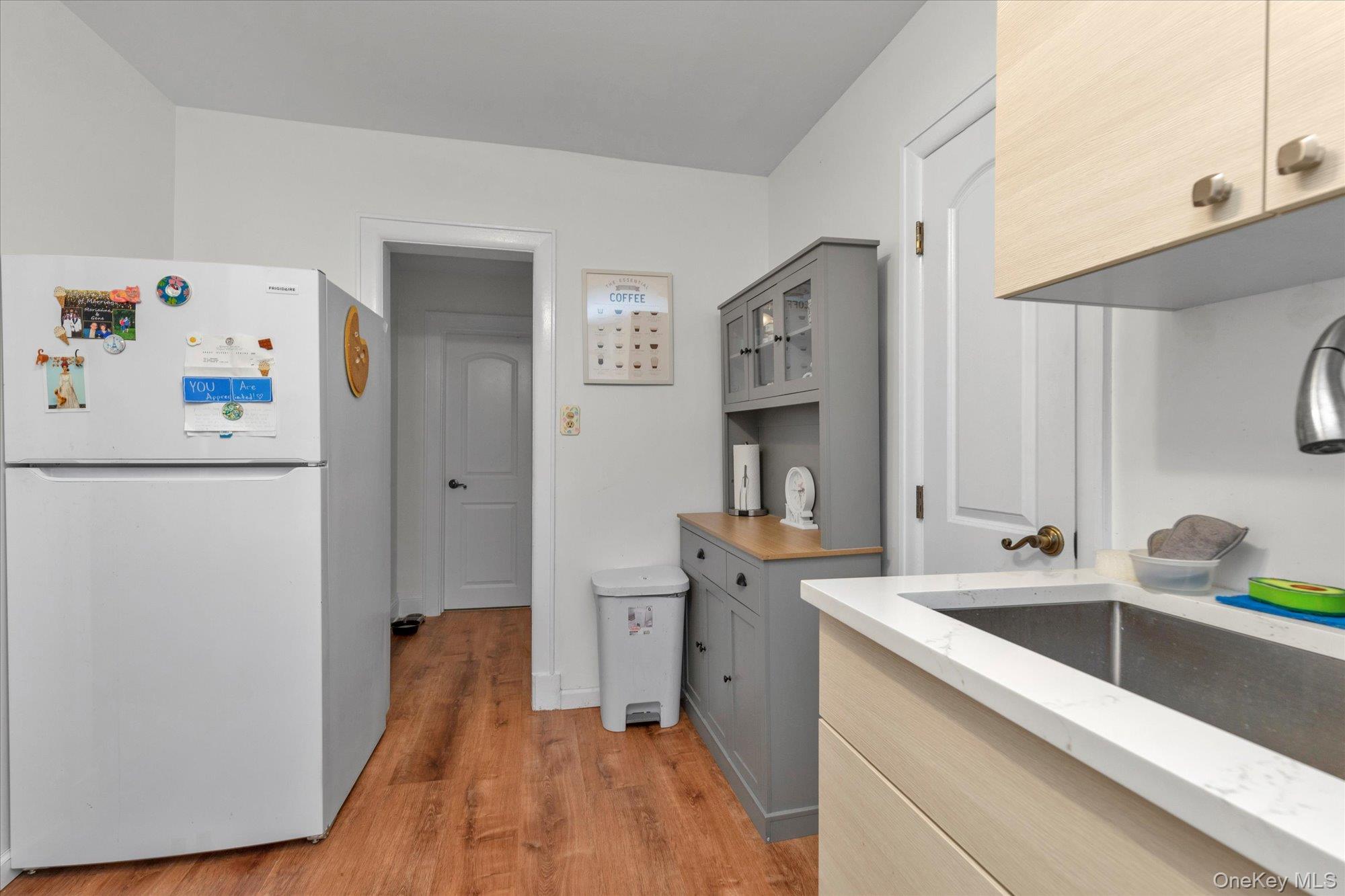 32 5th Street Valley Stream, NY 11581 - Photo 12 of 23 a view of a kitchen with sink and refrigerator