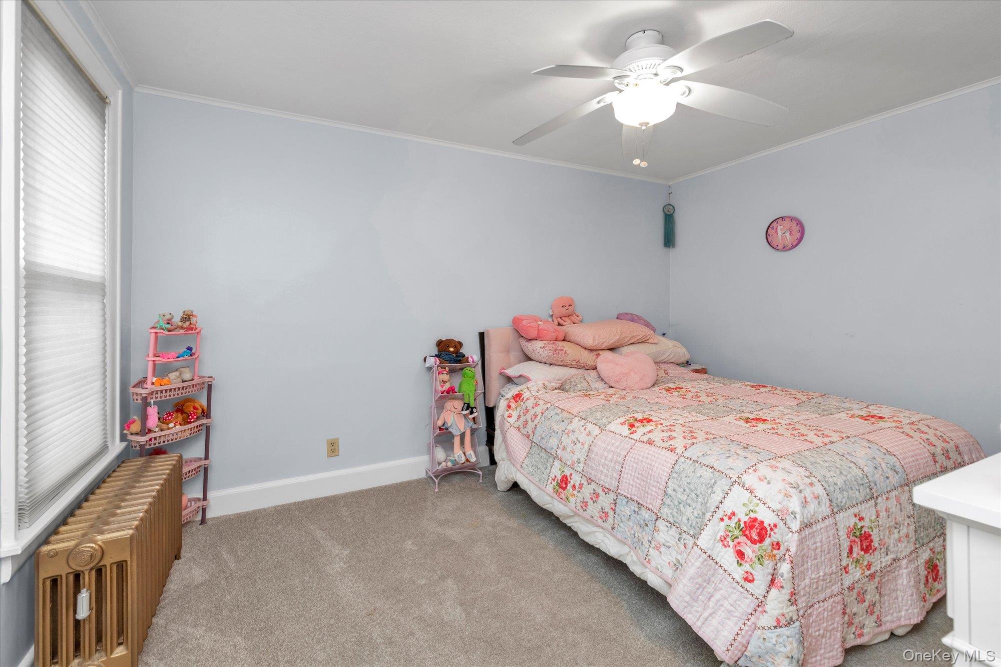 32 5th Street Valley Stream, NY 11581 - Photo 13 of 23 a bedroom with a bed and a chandelier