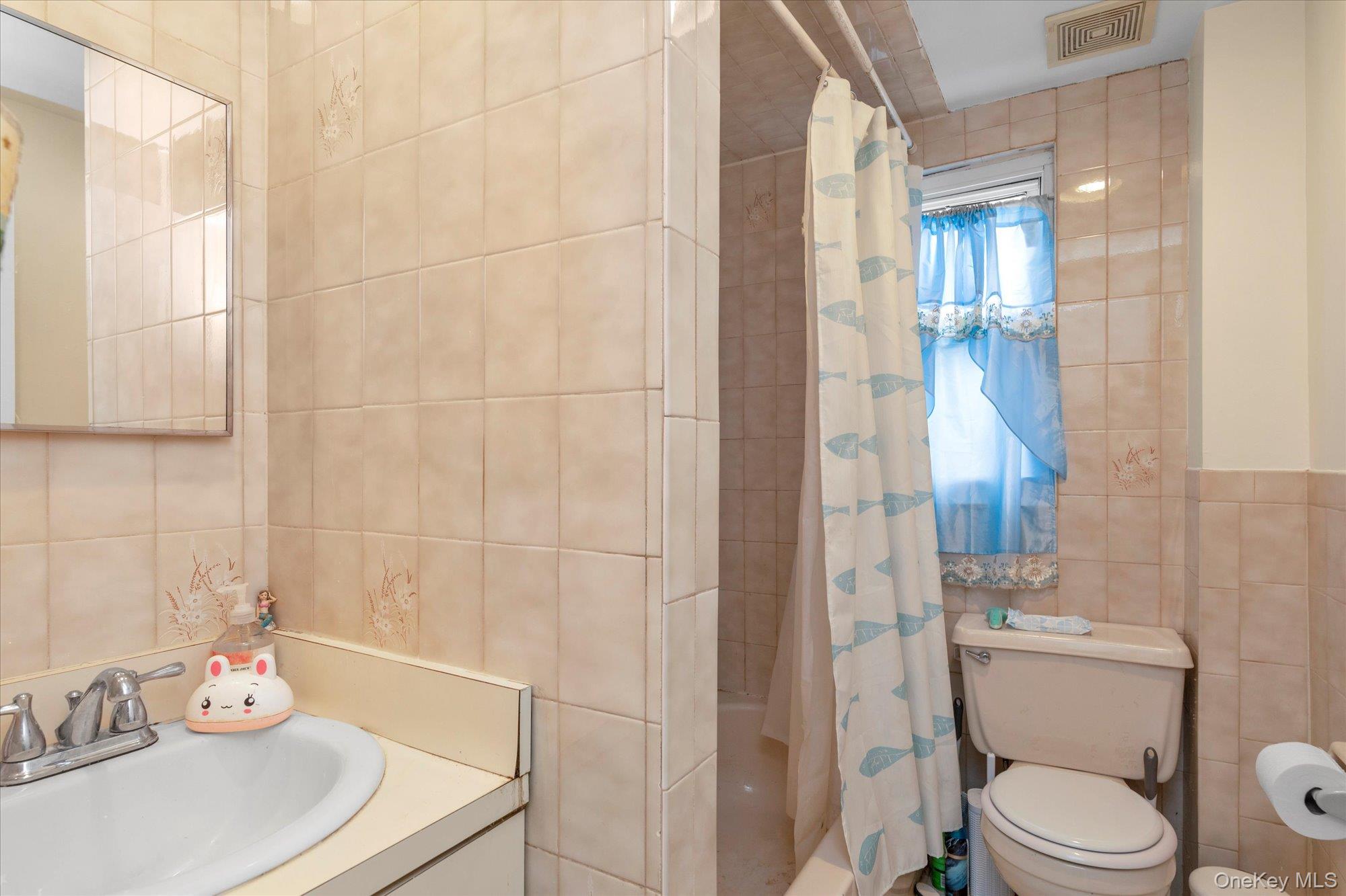 32 5th Street Valley Stream, NY 11581 - Photo 16 of 23 a bathroom with a granite countertop sink toilet and shower