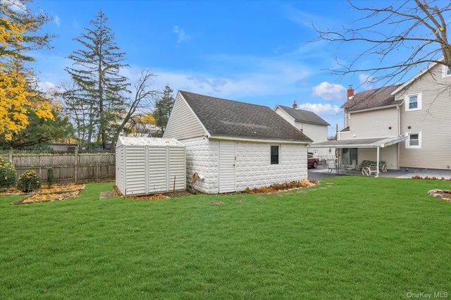 a front view of a house with a yard porch and sitting area